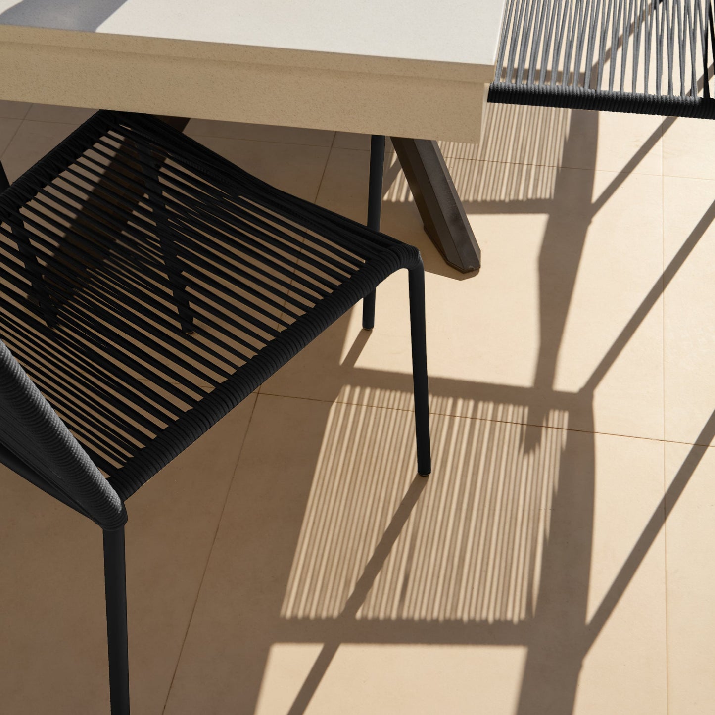 Amelia 6 Seater Pale Grey Concrete Garden Dining Set with Ryder Black Chairs - Laura James