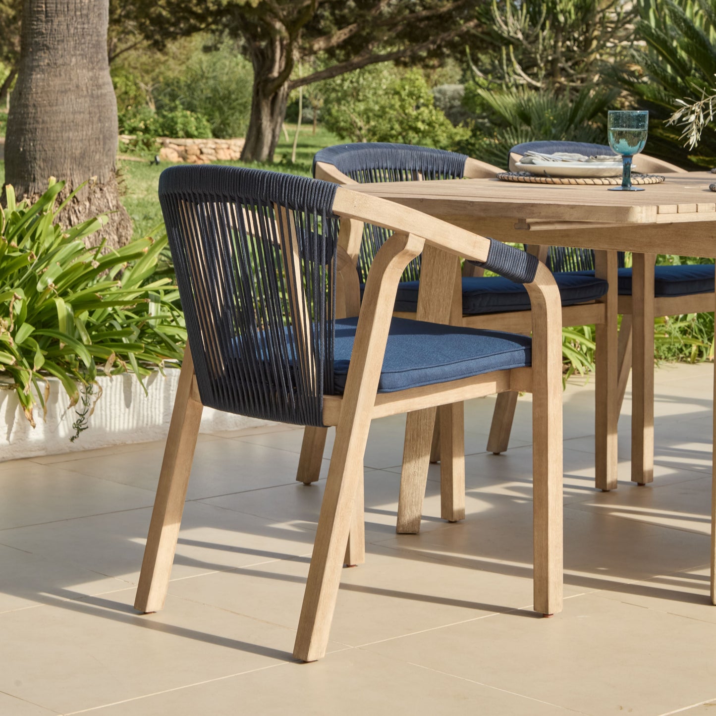 Saffron 6 Seater Extending Wooden Garden Dining Set with Shiro Navy Rope Chairs - Laura James