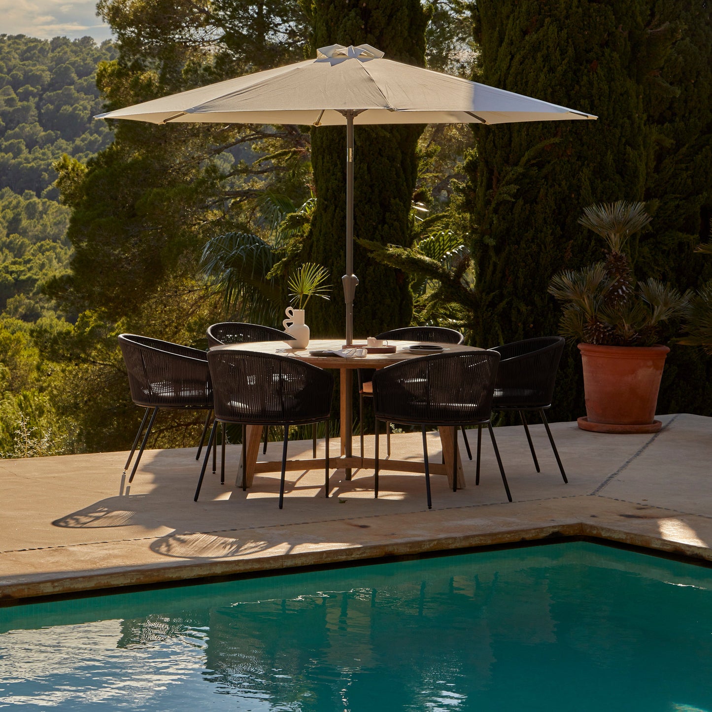 Shiro 6 seater wooden garden dining set with 6 hali black rope chairs and cream parasol- Laura James