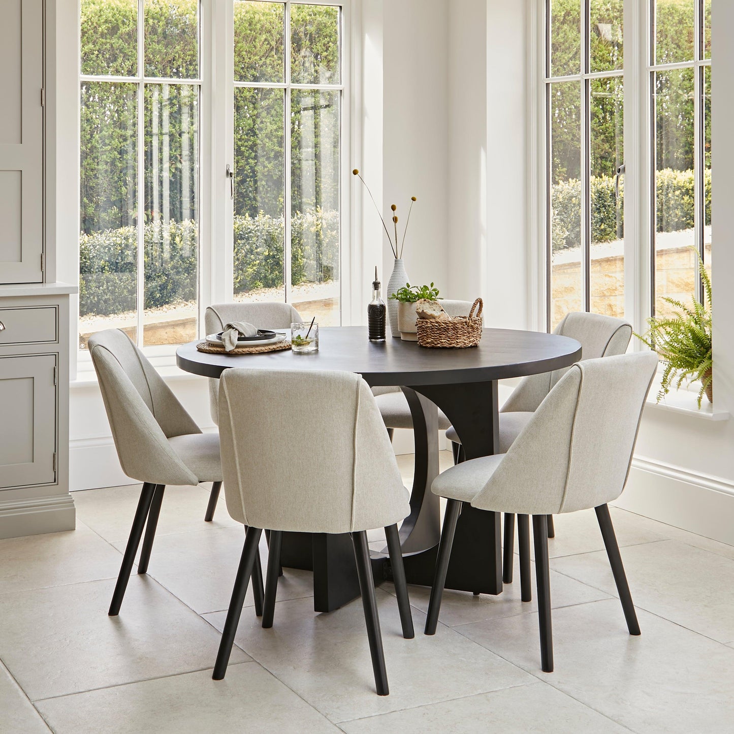 Jade 6 Seater Round Black Dining Table Set - Freya Oatmeal Dining Chairs with Black Legs - Laura James