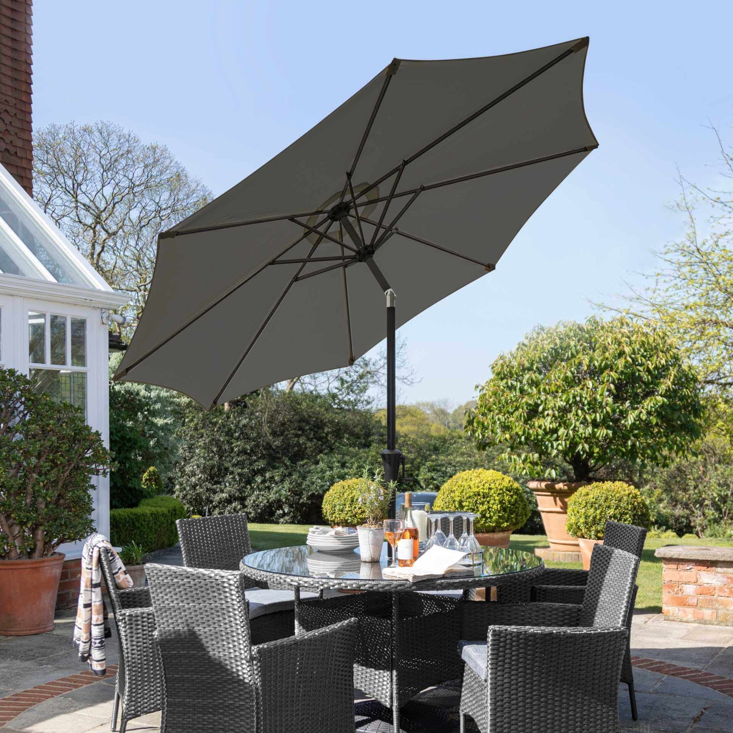 Kemble 6 Seater Rattan Round Dining Set with Grey LED Premium Parasol & Parasol Rain Cover - Grey