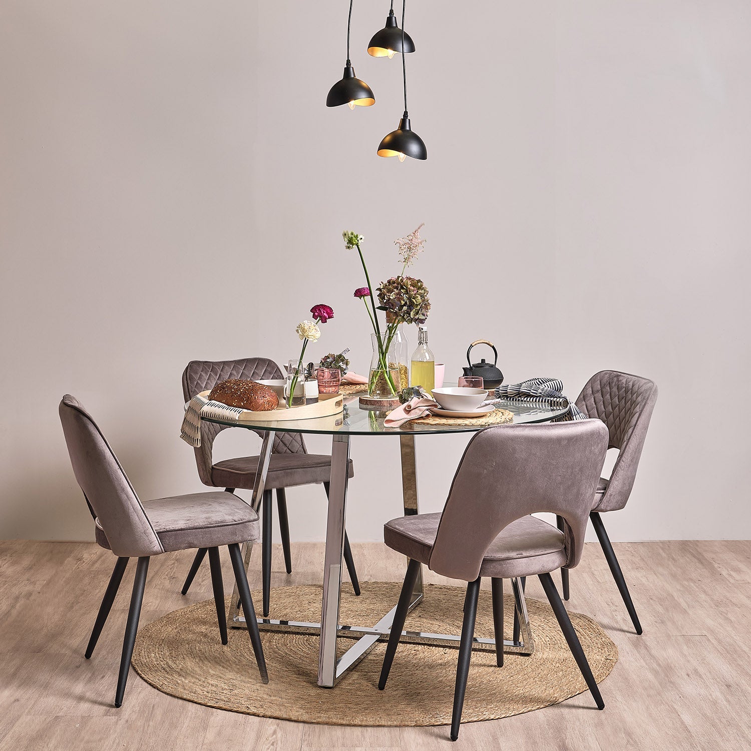 Clara glass round dining table - with chrome frame - Laura James