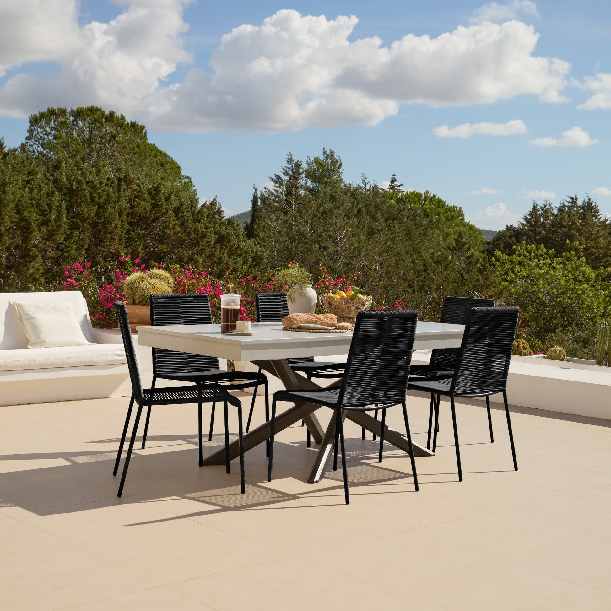 Amelia 6 Seater Pale Grey Concrete Garden Dining Set with Ryder Black Chairs - Laura James