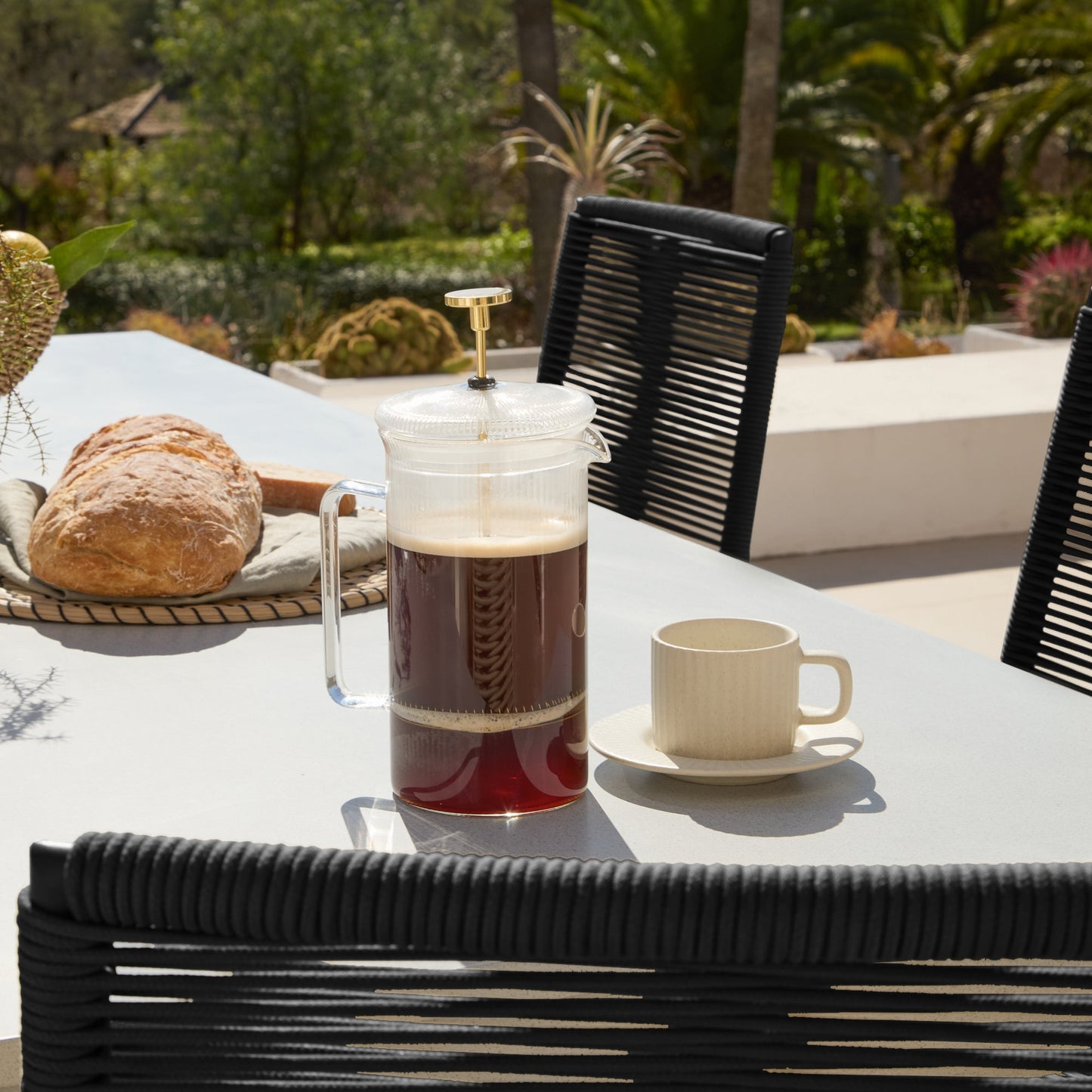 Amelia 6 Seater Pale Grey Concrete Garden Dining Set with Ryder Black Chairs - Laura James