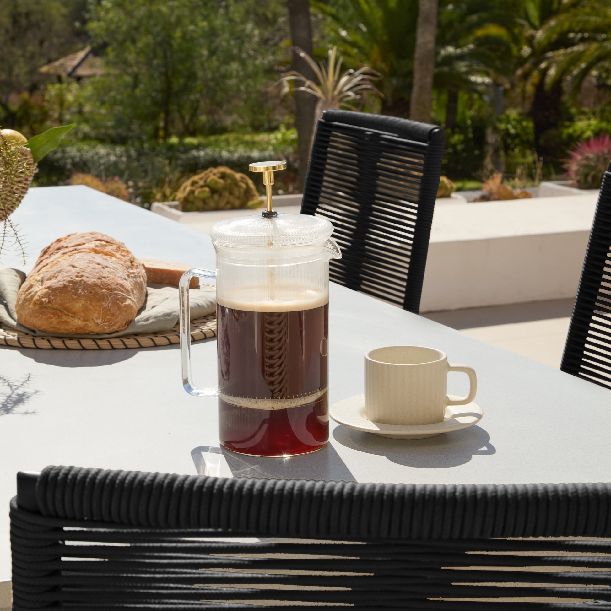 Amelia 6 Seater Pale Grey Concrete Garden Dining Set with Ryder Black Chairs - Laura James