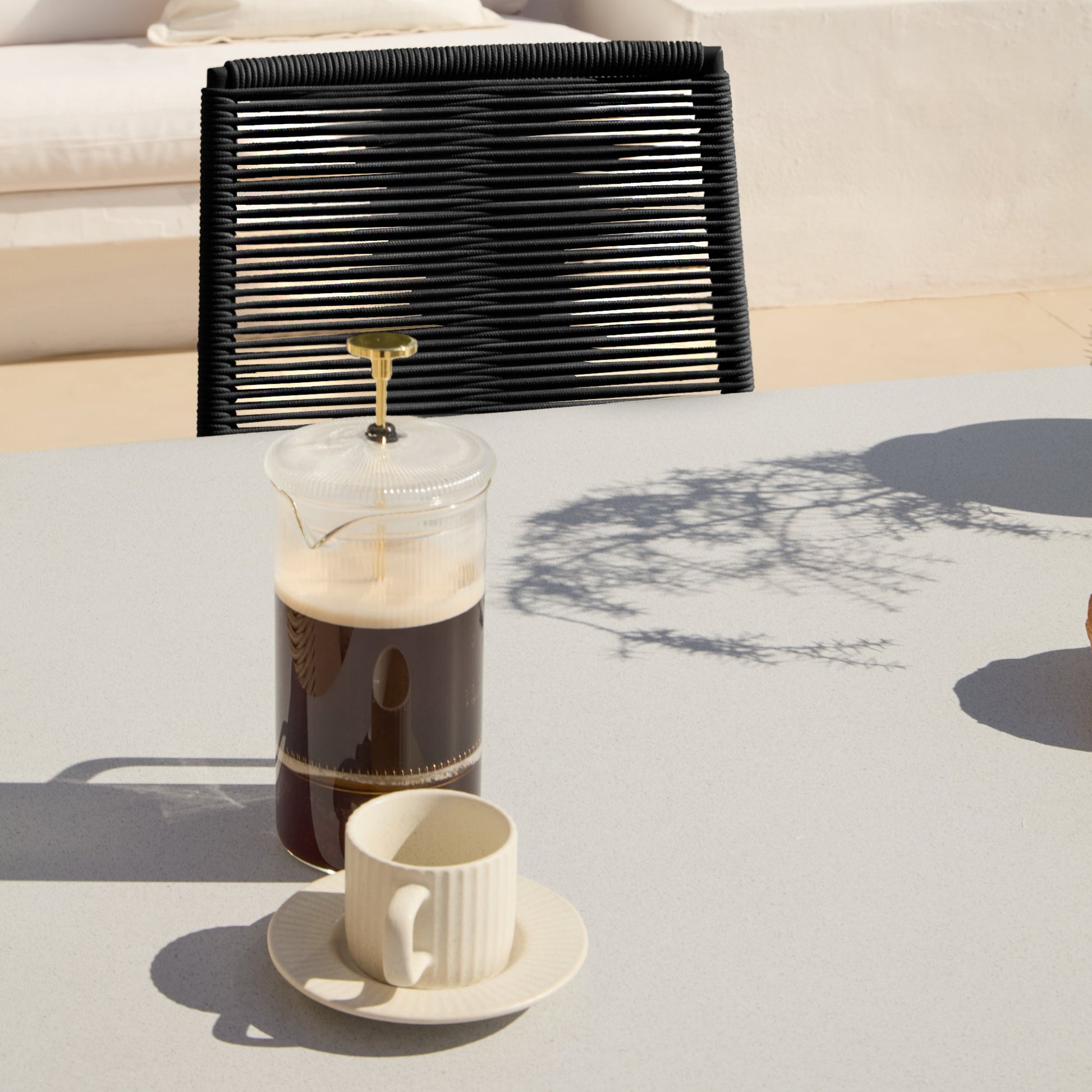 Amelia 6 Seater Pale Grey Concrete Garden Dining Set with Ryder Black Chairs - Laura James