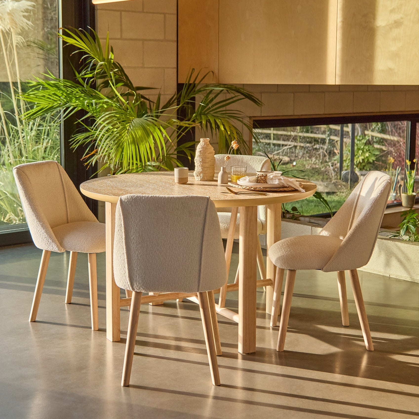 Carter Whitewash Round Dining Table with 4 Freya Boucle Dining Chairs with Whitewash Legs - Laura James 