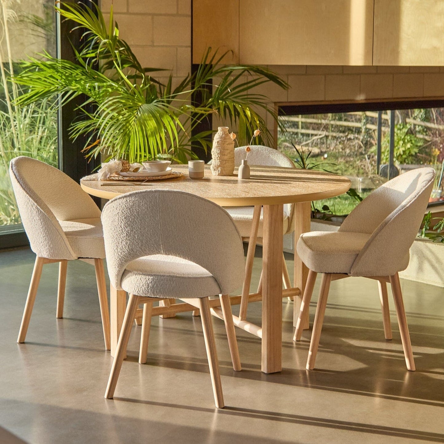 Carter Whitewash Round Dining Table with 4 marilyn Boucle Dining Chairs with Whitewash Legs - Laura James 