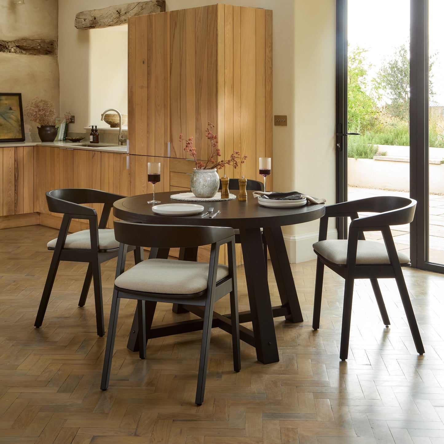 Charlotte Black Oak Round Dining Table Set - 4 Seater - Ella Black Oak Carver Chairs - Fawn Linen - Laura James 