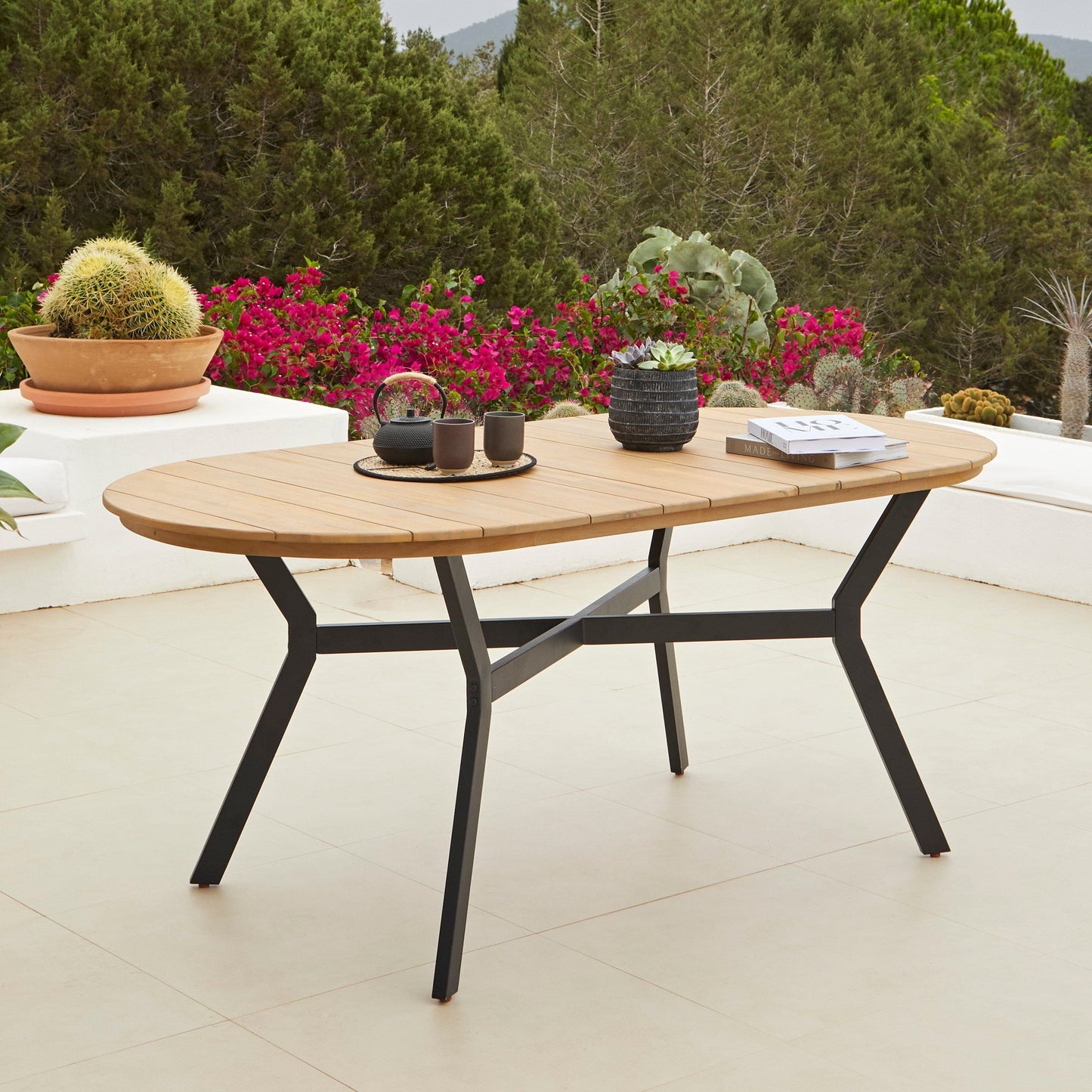 Ezra Oval Wooden Garden Table - White Acacia with Black Metal Legs - Laura James 