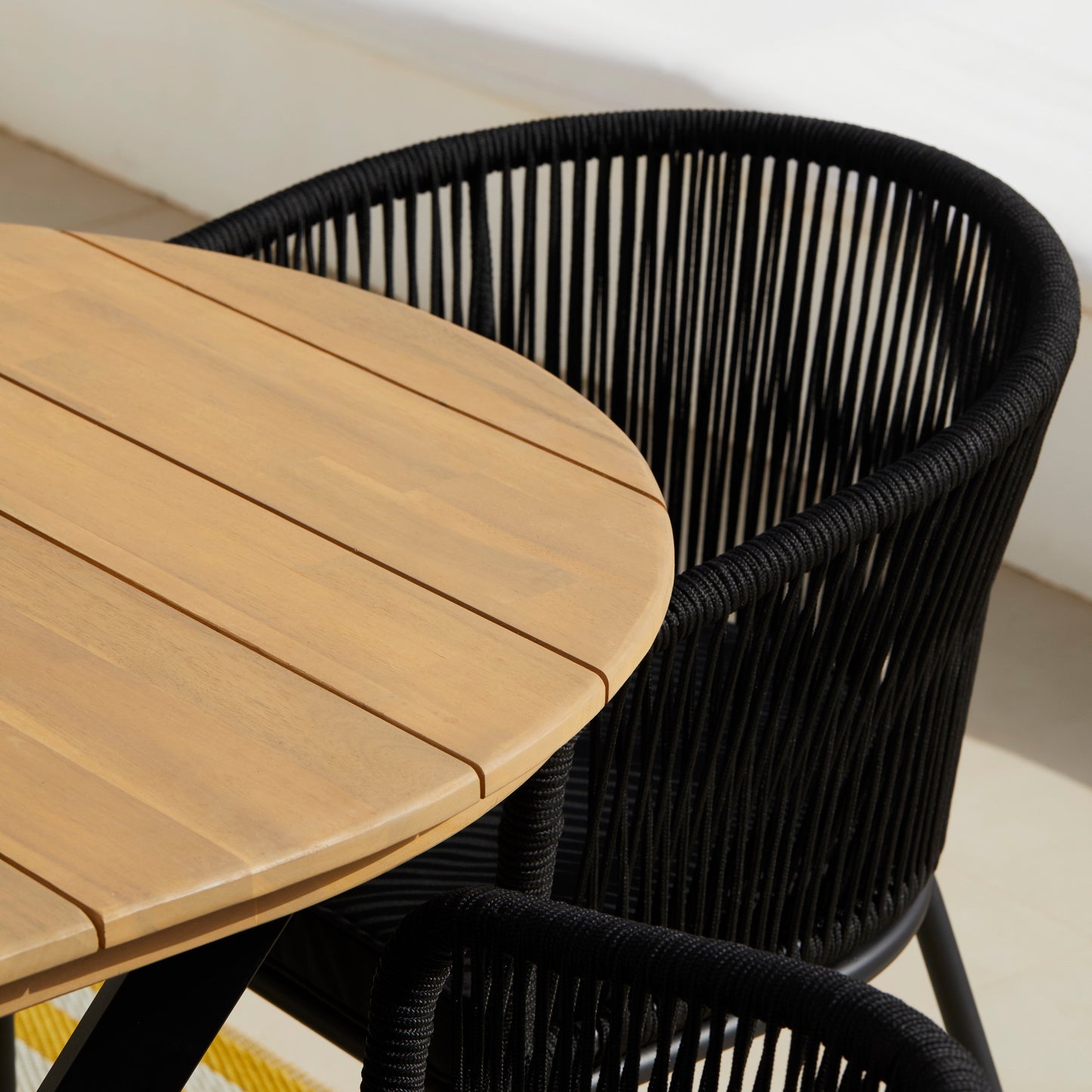 Ezra 6 Seater Oval Wooden Garden Dining Set with 6 Hali Black Rope Chairs - Laura James 