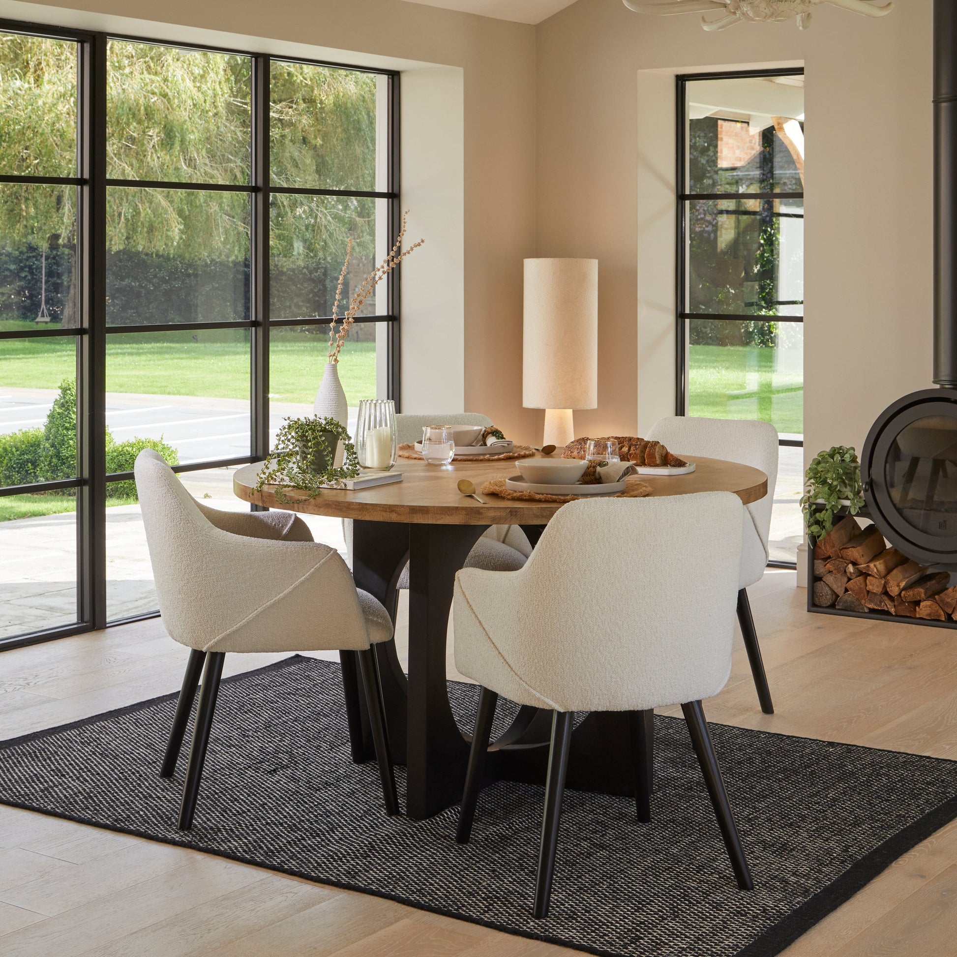 Levi Black Round Dining Table Set - 4 Seater - Freya Boucle Chairs with Black Legs - Laura James 