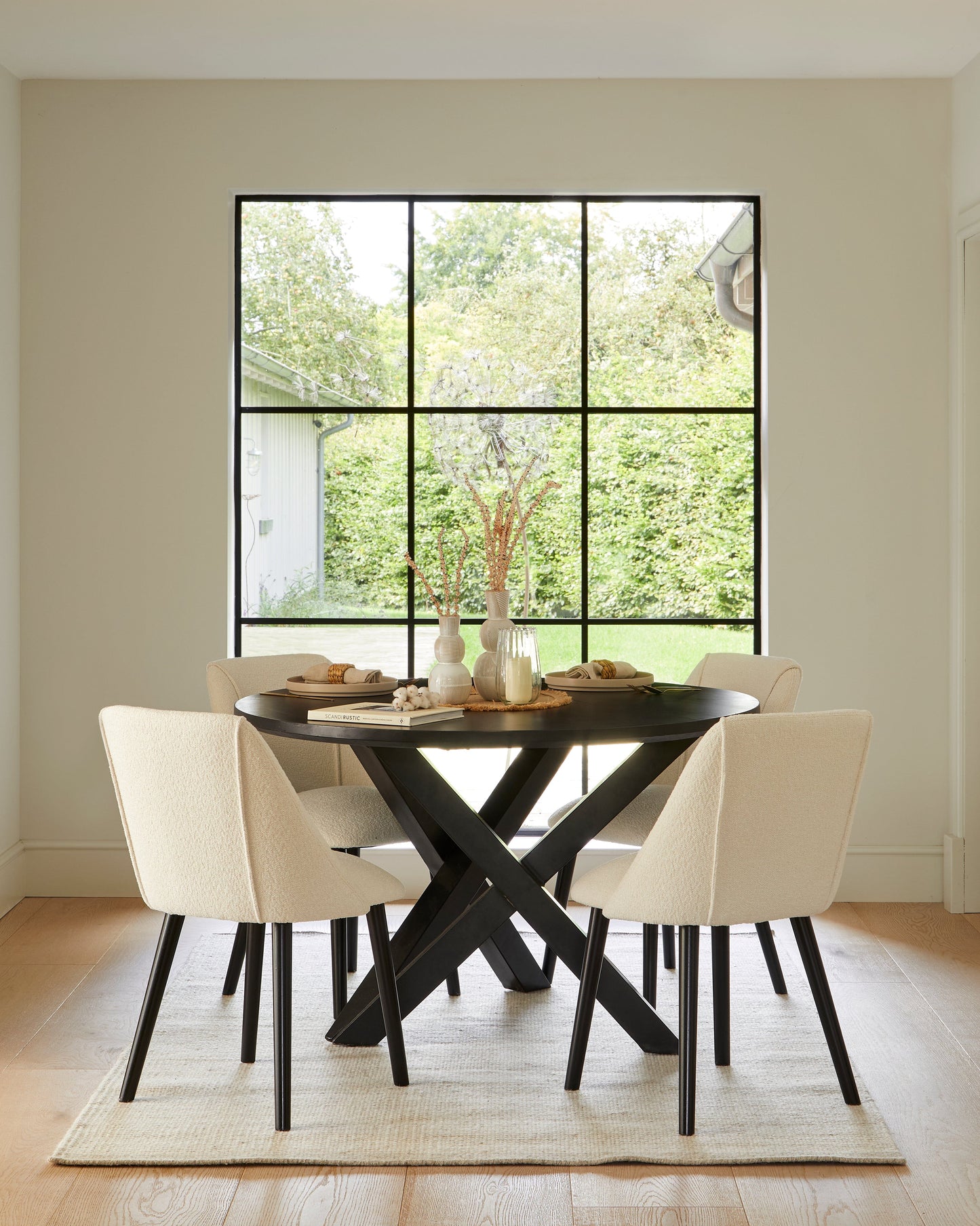 Levi Black Round Dining Table Set - 4 Seater - Freya Boucle Dining Chairs with Black Legs - Laura James 