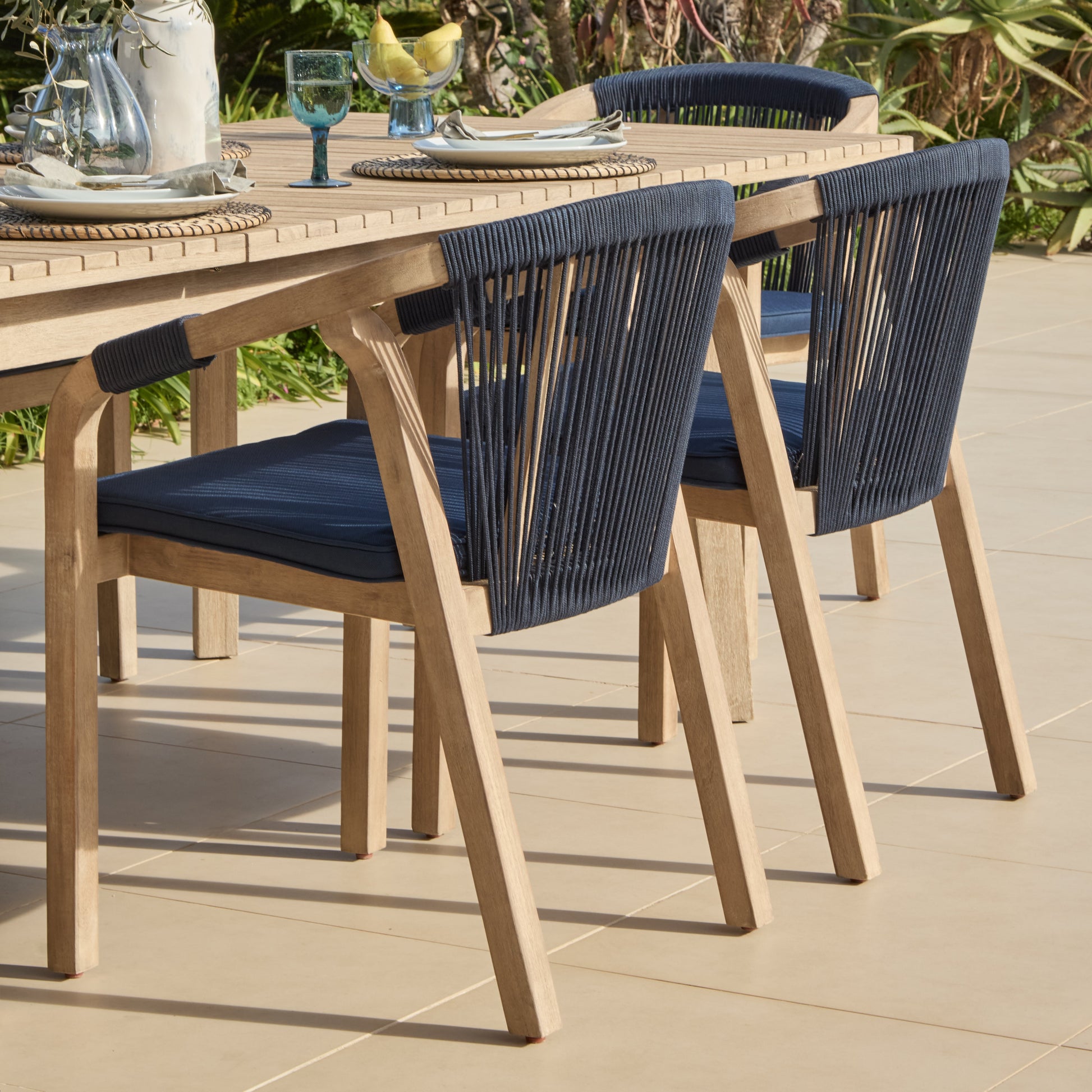 Saffron 6 Seater Extending Wooden Garden Dining Set with Shiro Navy Rope Chairs - Laura James