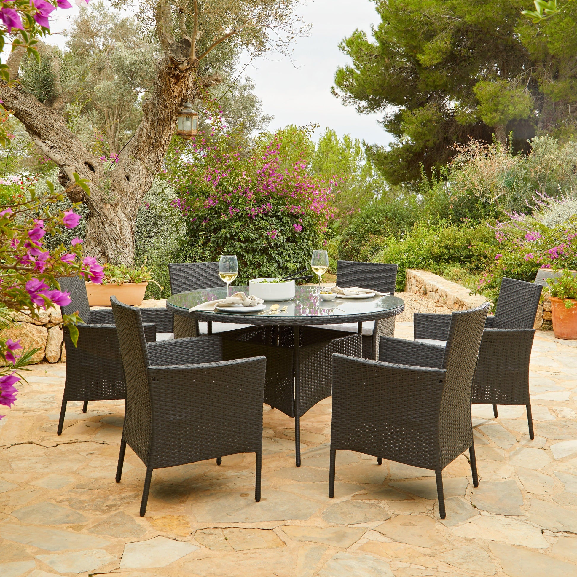 Kemble 6 Seater Rattan Round Outdoor Dining Table Set in Black - Rattan Garden Furniture - Laura James