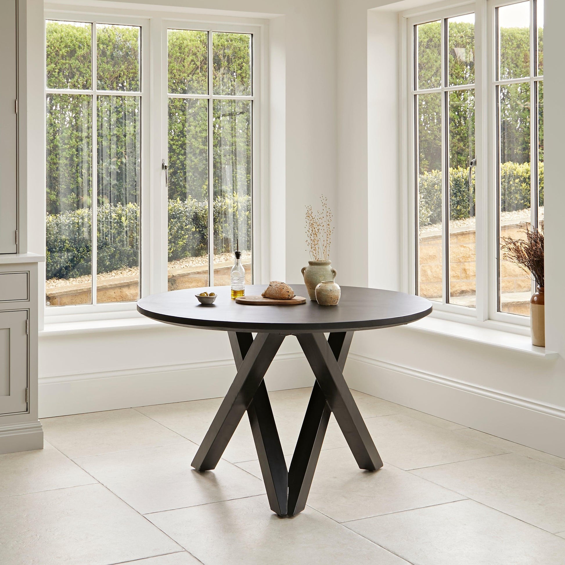 Levi Black Round Dining Table Set - 4 Seater - Freya Oatmeal Dining Chairs with Black Oak legs - Laura James