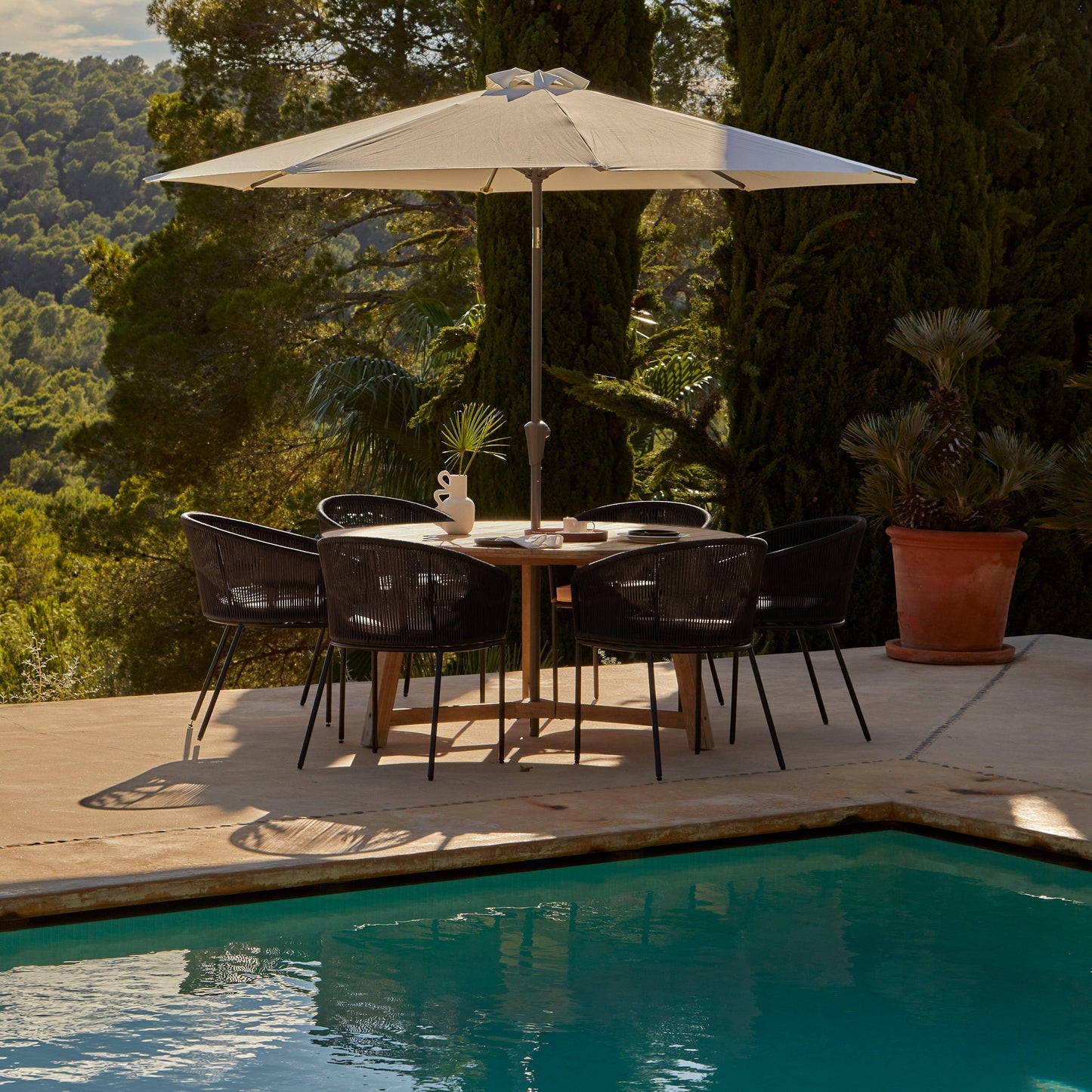 Shiro 6 seater wooden garden dining set with 6 hali black rope chairs and cream parasol- Laura James