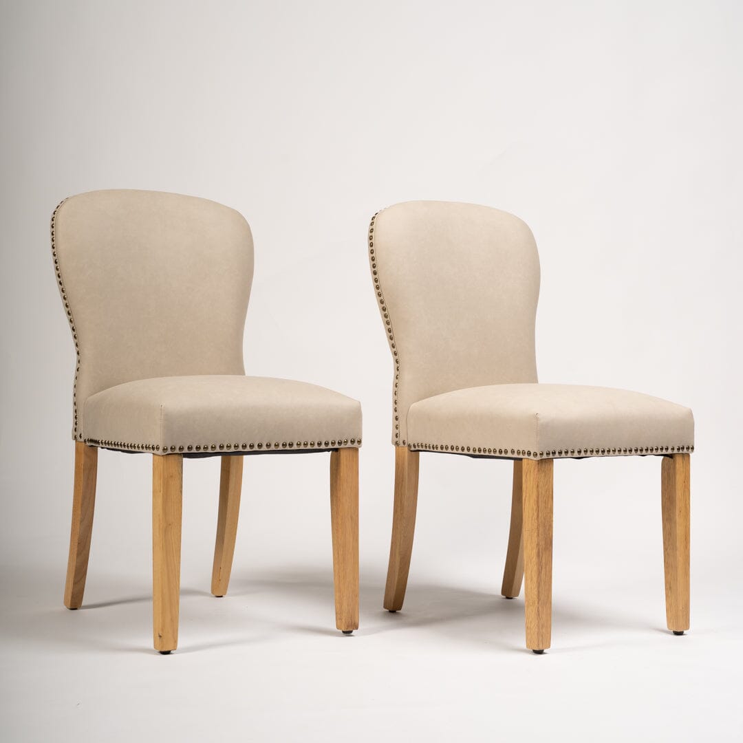 Faux leather store nailhead dining chairs