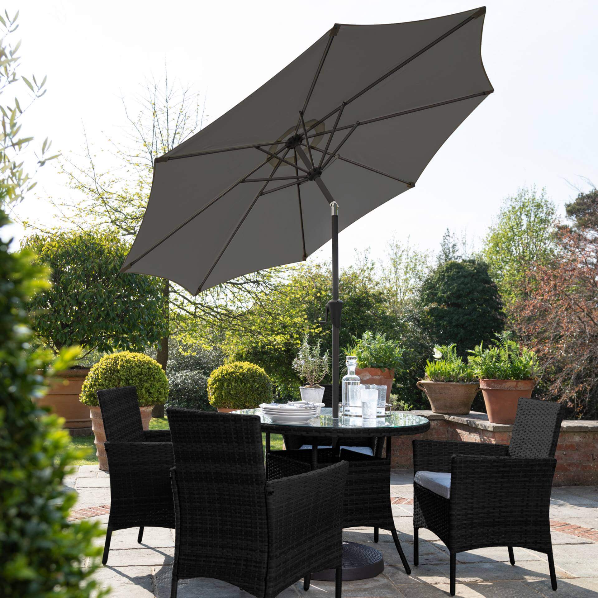 Kemble 4 Seater Rattan Round Dining Set with LED Premium Parasol and Parasol Rain Cover - Black